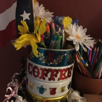 Artistic Coffee Cans make great pencil and pen containers.
